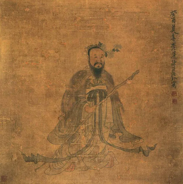 長い衣をまとい、腰に剣を下げて立つ屈原を描いた中国の古い人物画